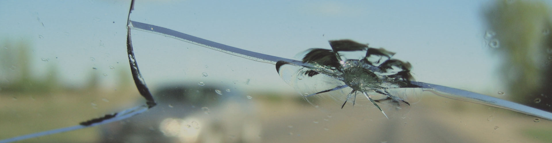 Long crack spreading across a vehicle windshield